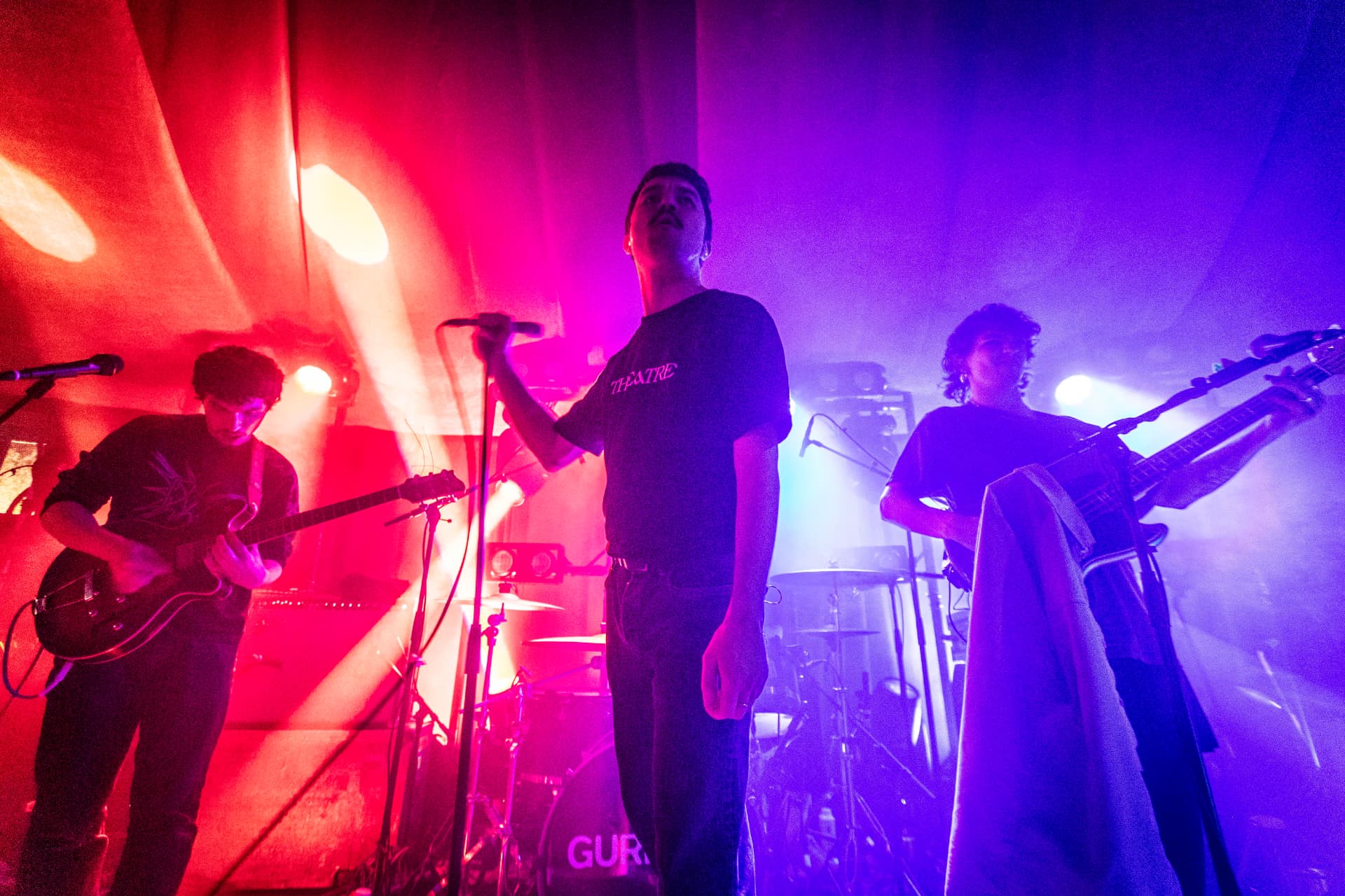 Gurriers performing under pink and purple stage lights